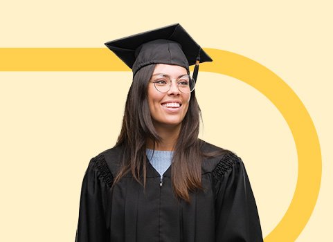 Woman in black graduation cap and gown smiling.