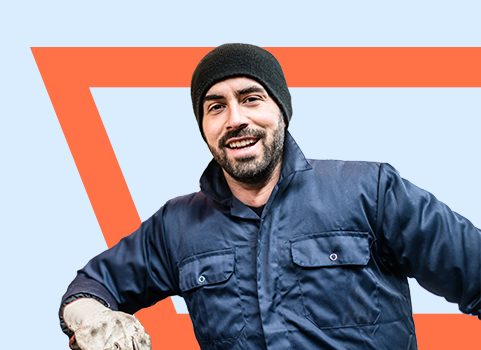 smiling man wearing gloves and a beanie.