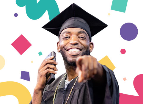 Penn Foster Graduate pointing at the camera and smiling during Graduation 2024.