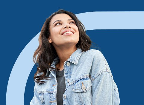 Young woman gazing upward with an optimistic look on her face.