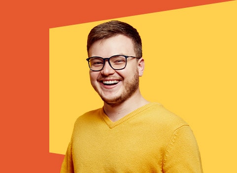smiling boy with glasses.