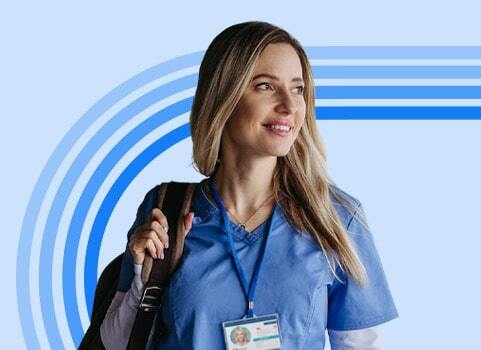 Woman in blue scrubs carrying backpack.